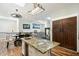 A kitchen with white cabinets, stainless steel appliances, hardwood floors, and an eat-in island at 5630 E Peak View Rd, Cave Creek, AZ 85331