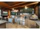 Gourmet outdoor kitchen boasting stainless steel appliances, granite countertops, pizza oven, and a brick fireplace at 5630 E Peak View Rd, Cave Creek, AZ 85331