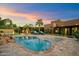 Tranquil backyard with a pool, lounge chairs, and outdoor kitchen with bar seating at 5630 E Peak View Rd, Cave Creek, AZ 85331