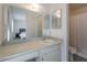 Bathroom featuring a large mirror, sink, and shower with a white shower curtain at 5817 S Siesta Ln, Tempe, AZ 85283