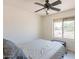 Bedroom with a window, a ceiling fan, and neutral tones for a peaceful ambiance at 5817 S Siesta Ln, Tempe, AZ 85283