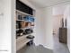Well-organized closet providing ample storage with shelves filled with belongings at 5817 S Siesta Ln, Tempe, AZ 85283