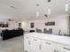 Open-concept kitchen and living area creating a spacious and inviting atmosphere for entertaining at 5817 S Siesta Ln, Tempe, AZ 85283