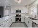 Well-appointed kitchen featuring stainless steel appliances, subway tile backsplash, and ample counter space at 5817 S Siesta Ln, Tempe, AZ 85283