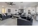 Open-concept living area with modern furniture and a view of the dining area and updated kitchen at 5817 S Siesta Ln, Tempe, AZ 85283