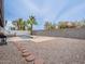 This backyard features a pool, grill, patio seating area, desert landscaping and privacy wall at 5817 S Siesta Ln, Tempe, AZ 85283