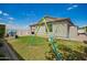 Lush backyard featuring a swing set and playhouse at 6550 S 24Th Pl, Phoenix, AZ 85042