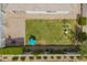 Aerial view of a well-manicured backyard with a play set, seating area, and lush landscaping at 6550 S 24Th Pl, Phoenix, AZ 85042