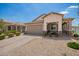Inviting home featuring desert landscaping, a brick-paved driveway, and a charming covered porch area at 6550 S 24Th Pl, Phoenix, AZ 85042