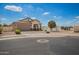 Charming single-story home showcasing neutral tones, a well-maintained yard, and convenient street access at 6550 S 24Th Pl, Phoenix, AZ 85042