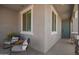 Cozy front porch with seating, offering a warm welcome with its neutral tones and outdoor charm at 6550 S 24Th Pl, Phoenix, AZ 85042