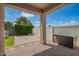 Covered patio with brick flooring overlooking the fenced backyard and outdoor storage at 6550 S 24Th Pl, Phoenix, AZ 85042