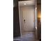 Inviting entryway with a white front door and wood-look tile flooring at 7120 E Wilshire Dr # 10, Scottsdale, AZ 85257
