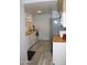 A view of a bright kitchen featuring white appliances, wood countertops, and sleek cabinets at 7120 E Wilshire Dr # 10, Scottsdale, AZ 85257