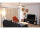 Bright living room featuring a sofa, accent chair, and stylish decor at 7120 E Wilshire Dr # 10, Scottsdale, AZ 85257