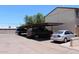 Covered parking area showing cars parked in designated spots next to a condo building at 7120 E Wilshire Dr # 10, Scottsdale, AZ 85257