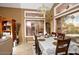 Bright dining room featuring a large window and a stylish chandelier at 7456 W Via Montoya Dr, Glendale, AZ 85310