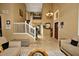 Spacious foyer with travertine floors, chandelier, and staircase leading to the second floor at 7456 W Via Montoya Dr, Glendale, AZ 85310