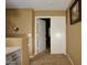 Upstairs hallway features a linen closet, neutral tones, and carpet for a clean and welcoming look at 7456 W Via Montoya Dr, Glendale, AZ 85310