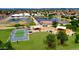 Aerial view of the community park featuring playgrounds, baseball field and tennis courts in a developed neighborhood at 7625 W Dreyfus Dr, Peoria, AZ 85381