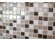 Detailed view of the kitchen backsplash featuring mosaic tiles at 7625 W Dreyfus Dr, Peoria, AZ 85381
