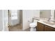 Bathroom with a glass door shower, toilet, vanity with a sink and a mirror at 7625 W Dreyfus Dr, Peoria, AZ 85381