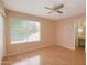 Neutral bedroom boasts a sliding door to the outside and an ensuite bathroom at 7625 W Dreyfus Dr, Peoria, AZ 85381