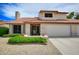 Home with a two-car garage, a tile roof, and desert landscaping at 7625 W Dreyfus Dr, Peoria, AZ 85381