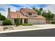 Inviting home featuring a tile roof, desert landscaping, and a spacious two-car garage at 7625 W Dreyfus Dr, Peoria, AZ 85381