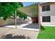 Covered parking area with storage, next to a well-manicured lawn at 7625 W Dreyfus Dr, Peoria, AZ 85381