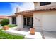 Well-kept home with a two-car garage, a tile roof, and desert landscaping at 7625 W Dreyfus Dr, Peoria, AZ 85381