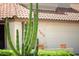 A home with well-maintained desert landscaping and a beautiful tile roof at 7625 W Dreyfus Dr, Peoria, AZ 85381