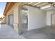 Spacious two-car garage featuring ample lighting, and convenient access to laundry and storage areas at 7625 W Dreyfus Dr, Peoria, AZ 85381