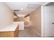Neutral-toned hallway with carpeted floor and railing overlooking the level below at 7625 W Dreyfus Dr, Peoria, AZ 85381