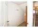 A hallway features a coat rack on the white wall next to a storage area at 7625 W Dreyfus Dr, Peoria, AZ 85381