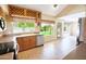 Open kitchen with ample natural light, stainless steel appliances and tile flooring at 7625 W Dreyfus Dr, Peoria, AZ 85381