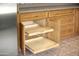 Kitchen cabinets with pull out wooden shelves, ideal for storing dishes at 7625 W Dreyfus Dr, Peoria, AZ 85381