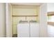 Convenient laundry area with a washer and dryer, located inside a closet at 7625 W Dreyfus Dr, Peoria, AZ 85381