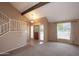 Open living area with high ceilings, a staircase, and a front door at 7625 W Dreyfus Dr, Peoria, AZ 85381