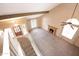 Aerial view of the living room showcasing the fireplace, staircase, and large windows at 7625 W Dreyfus Dr, Peoria, AZ 85381