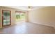 Bright living room with tile flooring, large window and a glass door leading to the backyard at 7625 W Dreyfus Dr, Peoria, AZ 85381