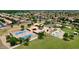 Aerial view of Sweetwater Park with multiple basketball and tennis courts with lush landscaping at 7625 W Dreyfus Dr, Peoria, AZ 85381