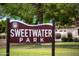 Sweetwater Park sign with a lush green background and blue skies at 7625 W Dreyfus Dr, Peoria, AZ 85381