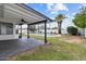 A covered patio overlooks a well-maintained backyard with pool and desert landscaping at 842 E Village Circle N Dr, Phoenix, AZ 85022