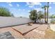 Desert landscaped backyard featuring a built-in fire pit and privacy fencing at 842 E Village Circle N Dr, Phoenix, AZ 85022