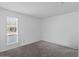 Neutral bedroom featuring a window with blinds and plush carpeting at 842 E Village Circle N Dr, Phoenix, AZ 85022