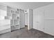 Spacious bedroom with built in shelving, neutral carpet, and white walls at 842 E Village Circle N Dr, Phoenix, AZ 85022