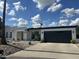 Charming single-story home with desert landscaping, a two-car garage, and a bright-white exterior at 842 E Village Circle N Dr, Phoenix, AZ 85022
