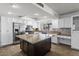 Modern kitchen with stainless steel appliances, white cabinets, and a granite island at 842 E Village Circle N Dr, Phoenix, AZ 85022