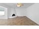 Spacious living room featuring tile floors, fresh paint, and a modern fireplace at 842 E Village Circle N Dr, Phoenix, AZ 85022